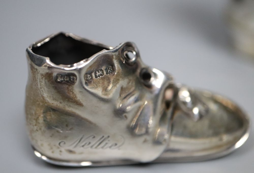 A silver novelty boot pin cushion, Levi & Salaman, Birmingham 1909 (lacking cushion),55m and a plated boot vesta
